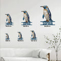Penguin metal sign shown in multiple size options on a living room wall