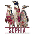Floral penguin metal sign featuring three penguins covered in colorful botanical patterns