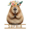 Floral capybara metal sign featuring a detailed animal portrait with folded paws and a colorful flower crown
