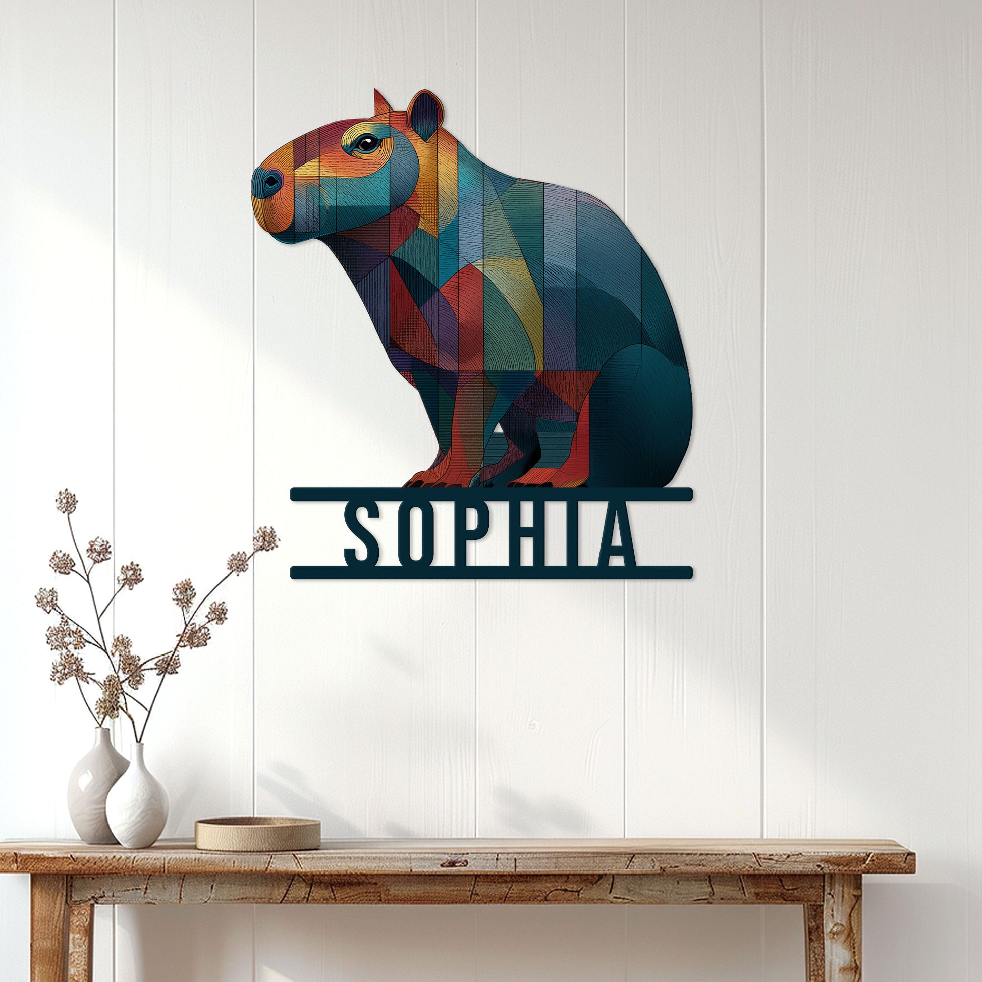 Colorful capybara metal wall sign displayed above a console table in a bright modern room