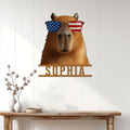 Patriotic capybara metal sign displayed on a bright paneled wall above a console table
