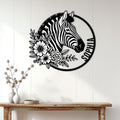 Floral zebra metal wall sign displayed above a console table in a bright home entryway