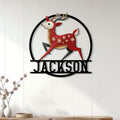 Colorful Christmas reindeer metal sign displayed on a light wood-paneled living room wall