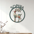 Floral patchwork reindeer metal sign displayed on a white paneled wall in a bright home entryway