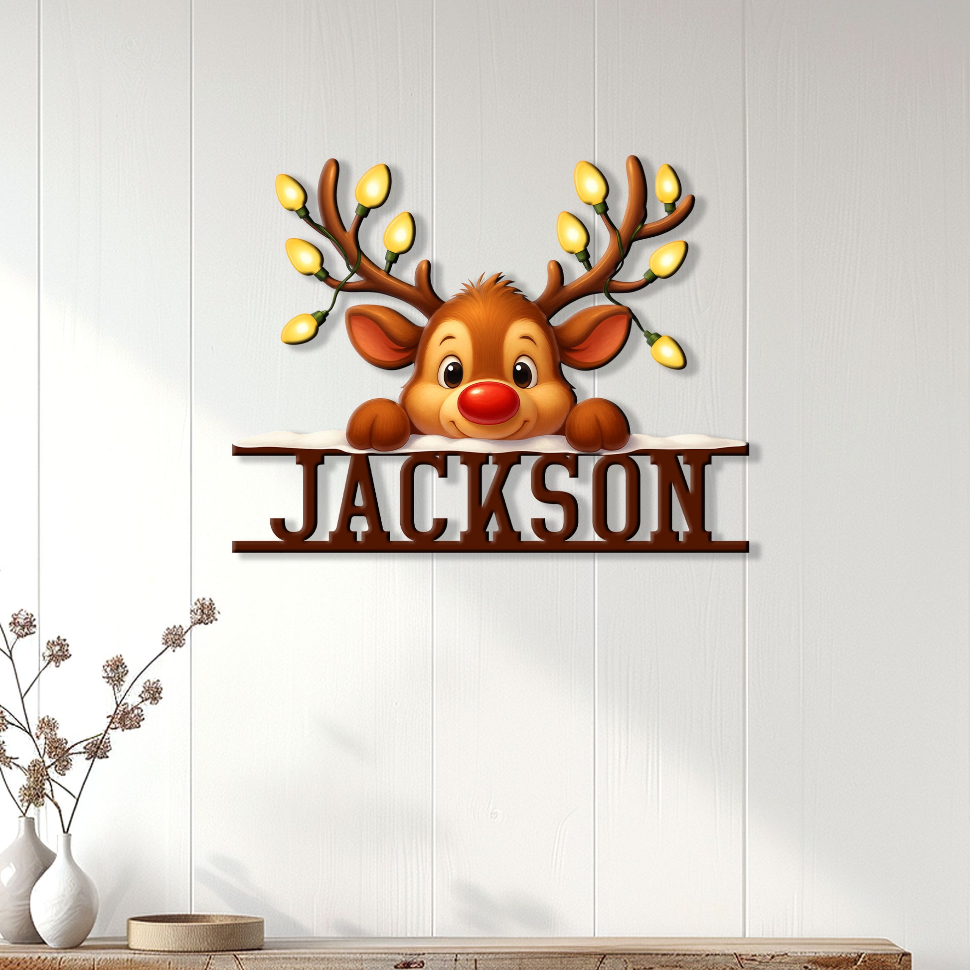 Reindeer Christmas metal sign displayed on a white paneled wall in a bright home