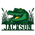 Custom alligator metal sign featuring a fierce green alligator emerging from marsh grass and cattails