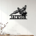 Tattoo machine metal wall sign displayed on a bright paneled wall as tattoo studio decor