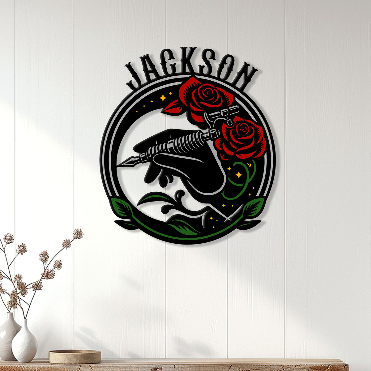 Tattoo machine and roses metal sign displayed as wall decor on a bright paneled wall
