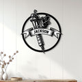 Tattoo studio wall decor featuring a black tattoo machine sign displayed on a light wood-paneled wall