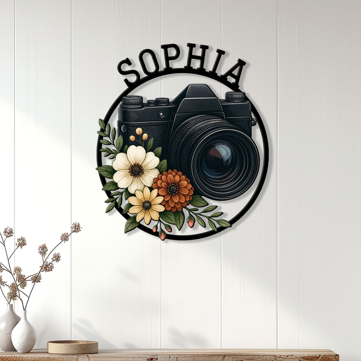 Photographer wall sign displayed on a light wood-paneled wall above a modern console