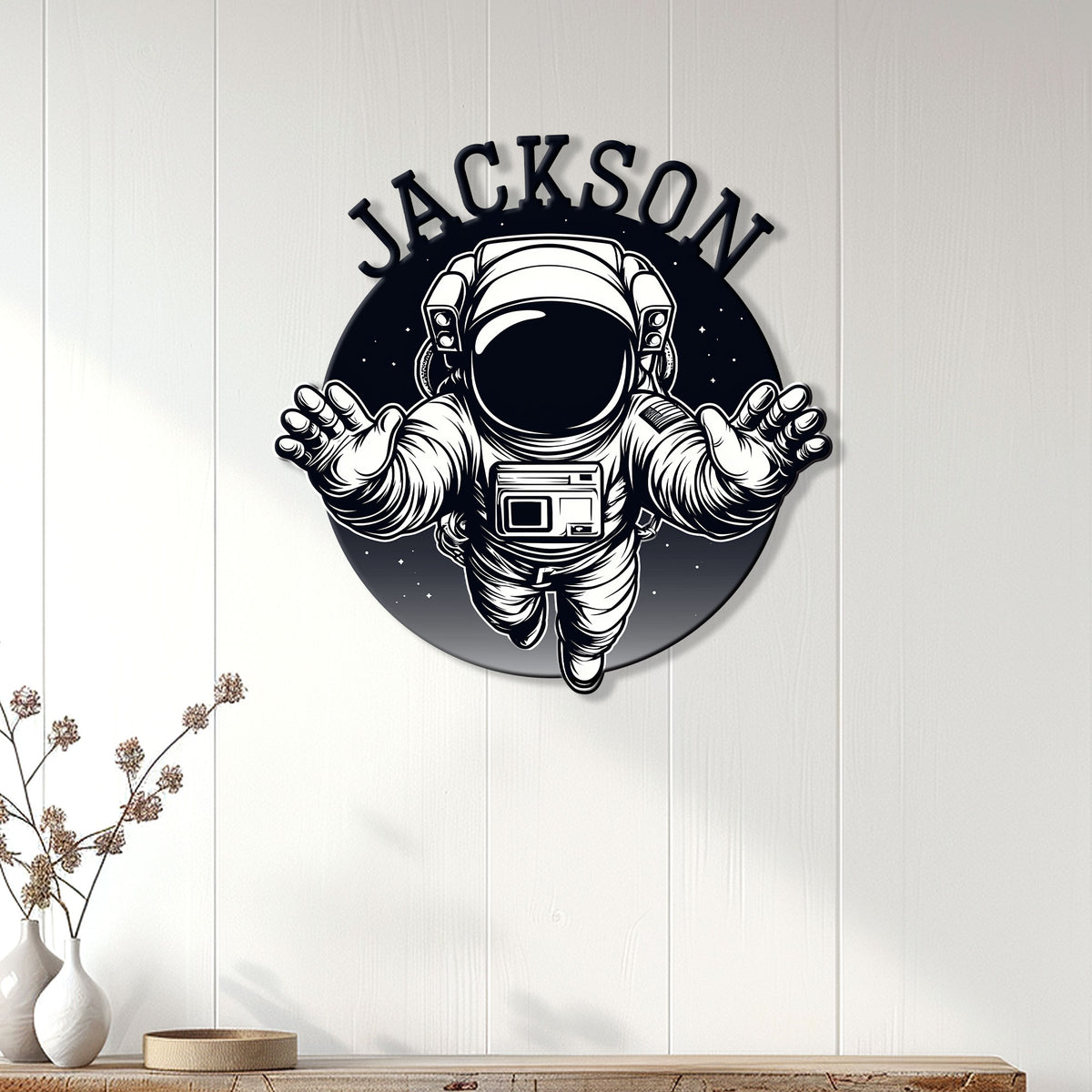 Astronaut wall sign displayed on white paneled decor for a modern space-themed room