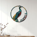 Colorful peacock wall sign displayed on white paneling above a console in a bright home interior