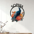 Floral peacock metal wall sign displayed on a bright white paneled wall in a home decor setting
