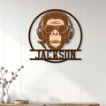 Custom monkey wall sign displayed on a light wood-paneled wall in a modern living space