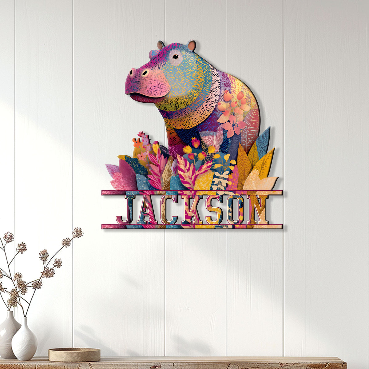 Colorful floral hippo metal wall sign displayed above a modern wood console