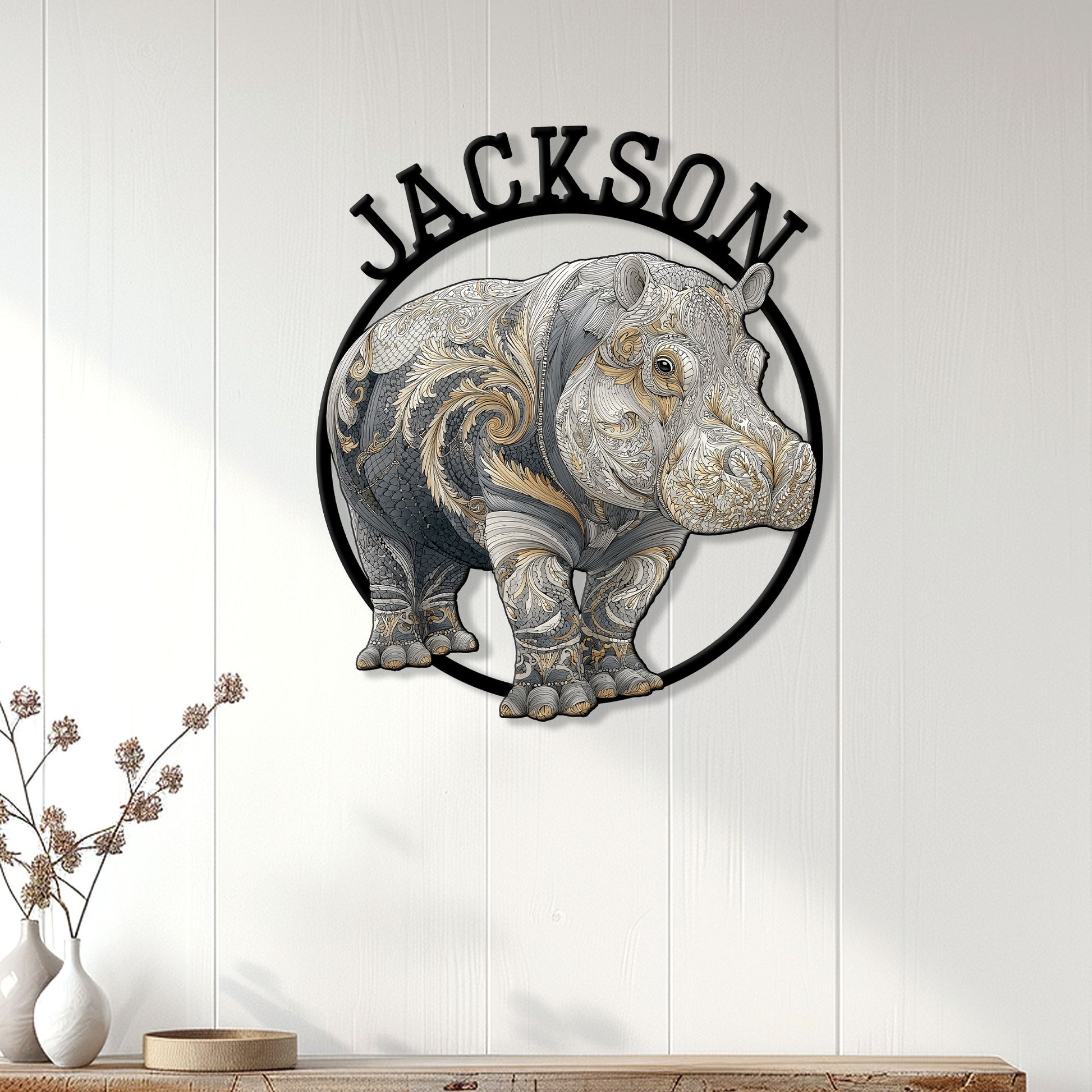 Ornate hippo wall sign displayed on a light wood-paneled wall above a console table