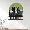 Hiking wall decor displayed on a light paneled wall, featuring family hikers and a mountain landscape