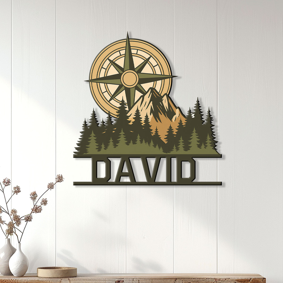 Compass and mountain hiking sign displayed as rustic wall decor in a bright home interior