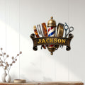 Barbershop wall decor displayed on white wood paneling in a clean salon or barber studio setting