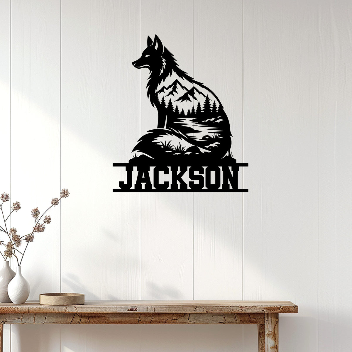 Wolf wilderness metal wall sign displayed on a white wood-paneled wall above a console table
