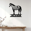 Horse wall decor displayed on a white paneled wall above a rustic console table