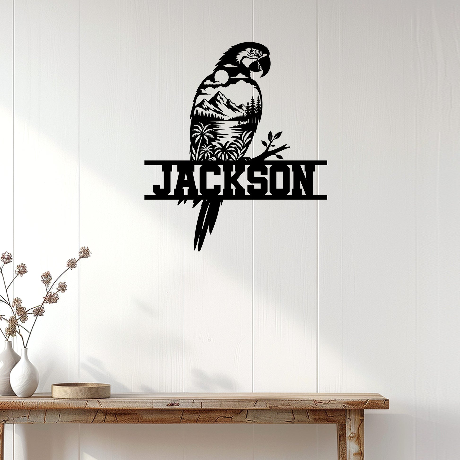 Black parrot wall sign displayed on a bright paneled wall above a rustic console table