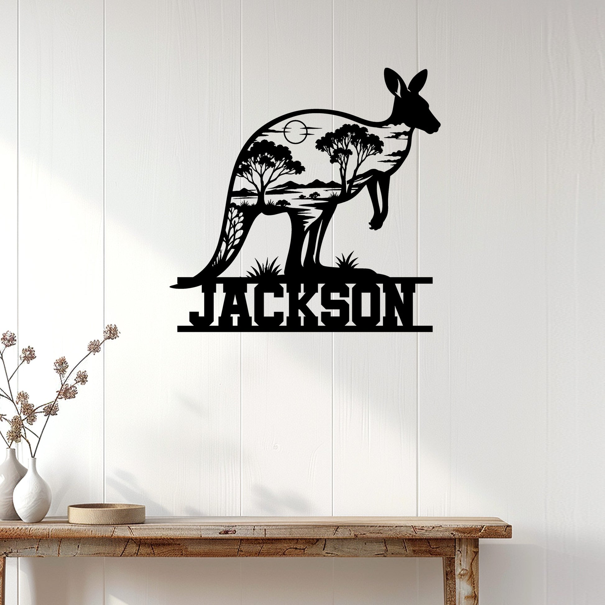 Kangaroo metal wall decor displayed on a white paneled wall above a rustic console table