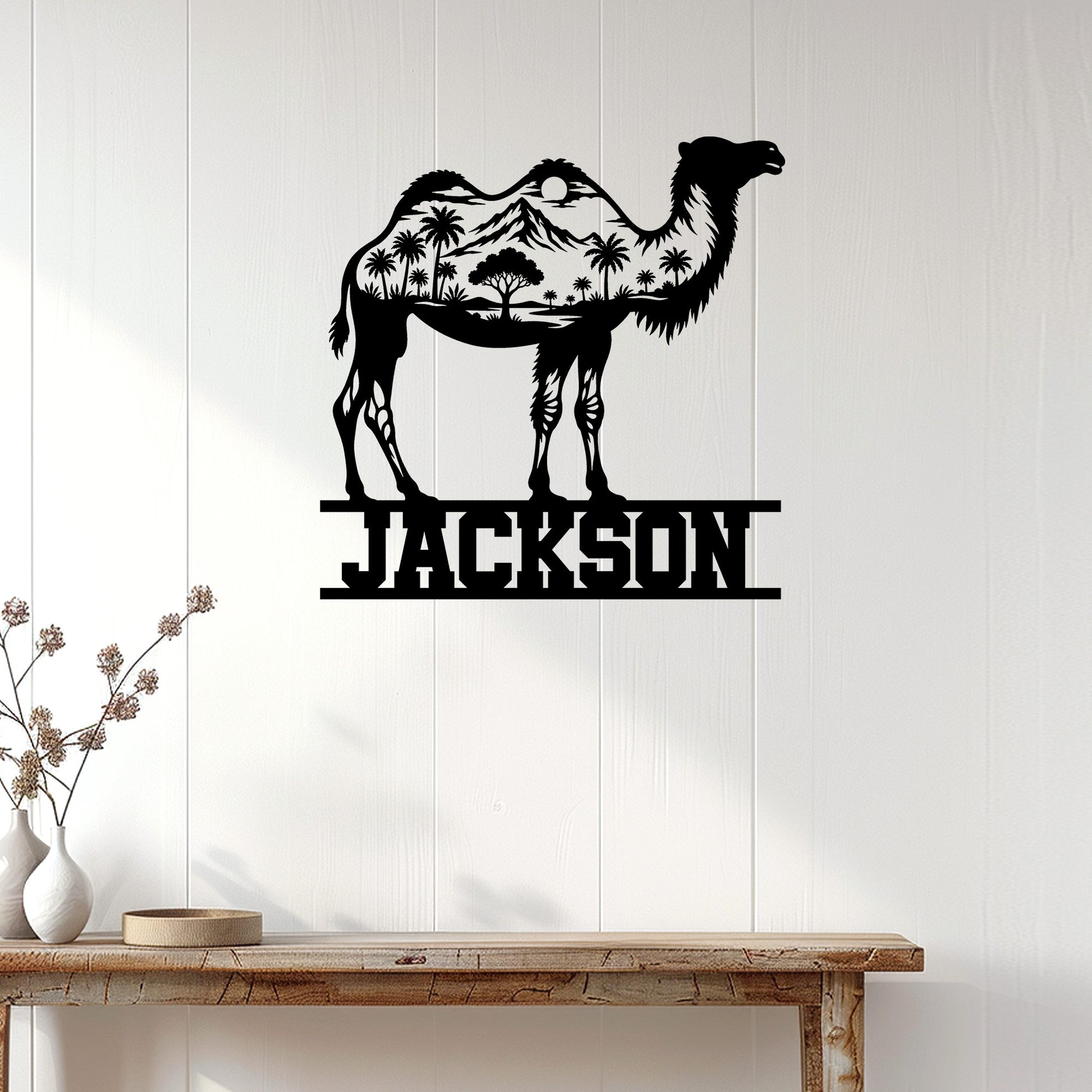 Camel wall sign displayed on a light wood-paneled wall above a console table