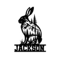Black rabbit silhouette with mountain, evergreen forest, and lake artwork for a woodland metal sign
