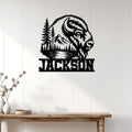 Bison wall sign displayed on white wood paneling above a rustic console table in a modern home