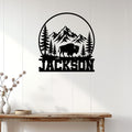 Bison wall sign displayed on a white paneled wall above a rustic wood console table