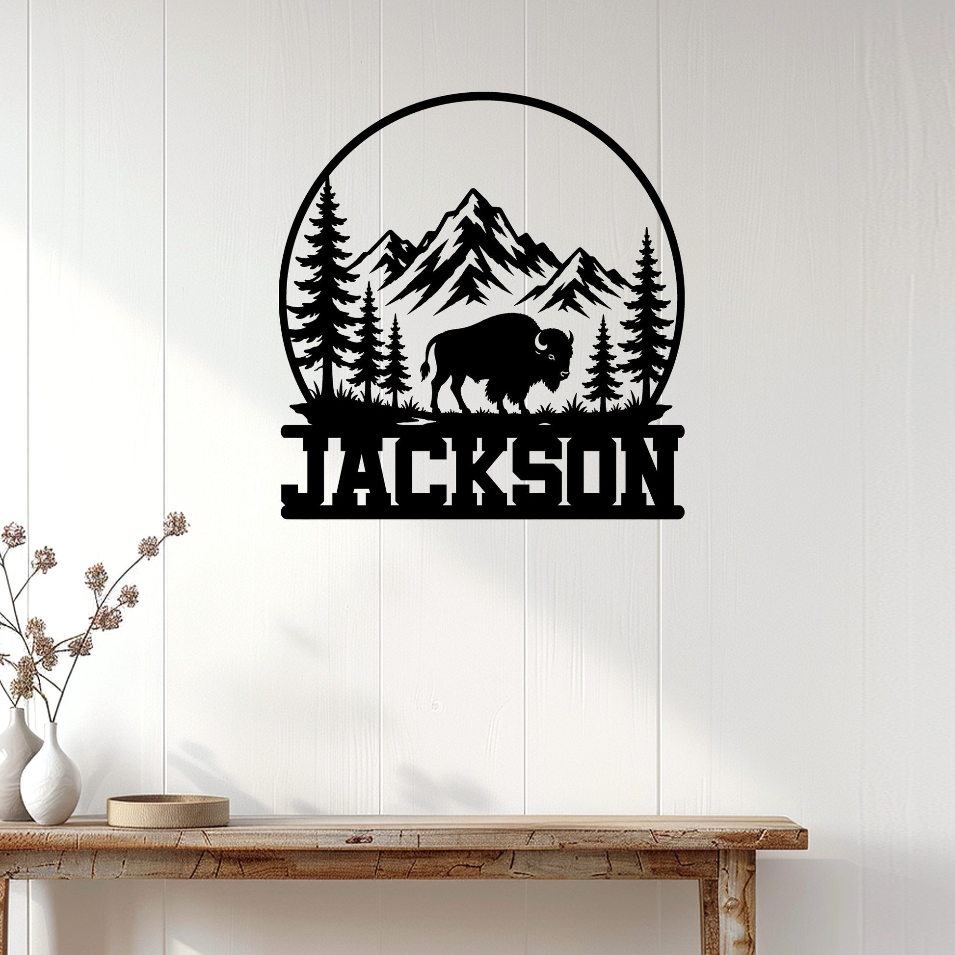 Bison wall sign displayed on a white paneled wall above a rustic wood console table