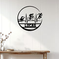 Triathlon wall sign displayed on white wood paneling, featuring swimmer, cyclist, and runner silhouettes