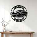 Classic car workshop wall sign displayed on a white paneled wall above a rustic console