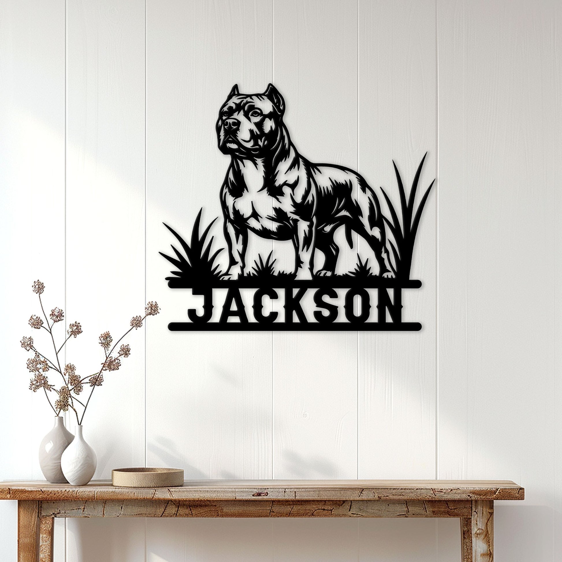American Bully metal wall sign displayed on a white paneled wall above a wood console table