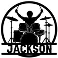 Drummer metal sign featuring a silhouetted musician playing a full drum kit inside a circular frame