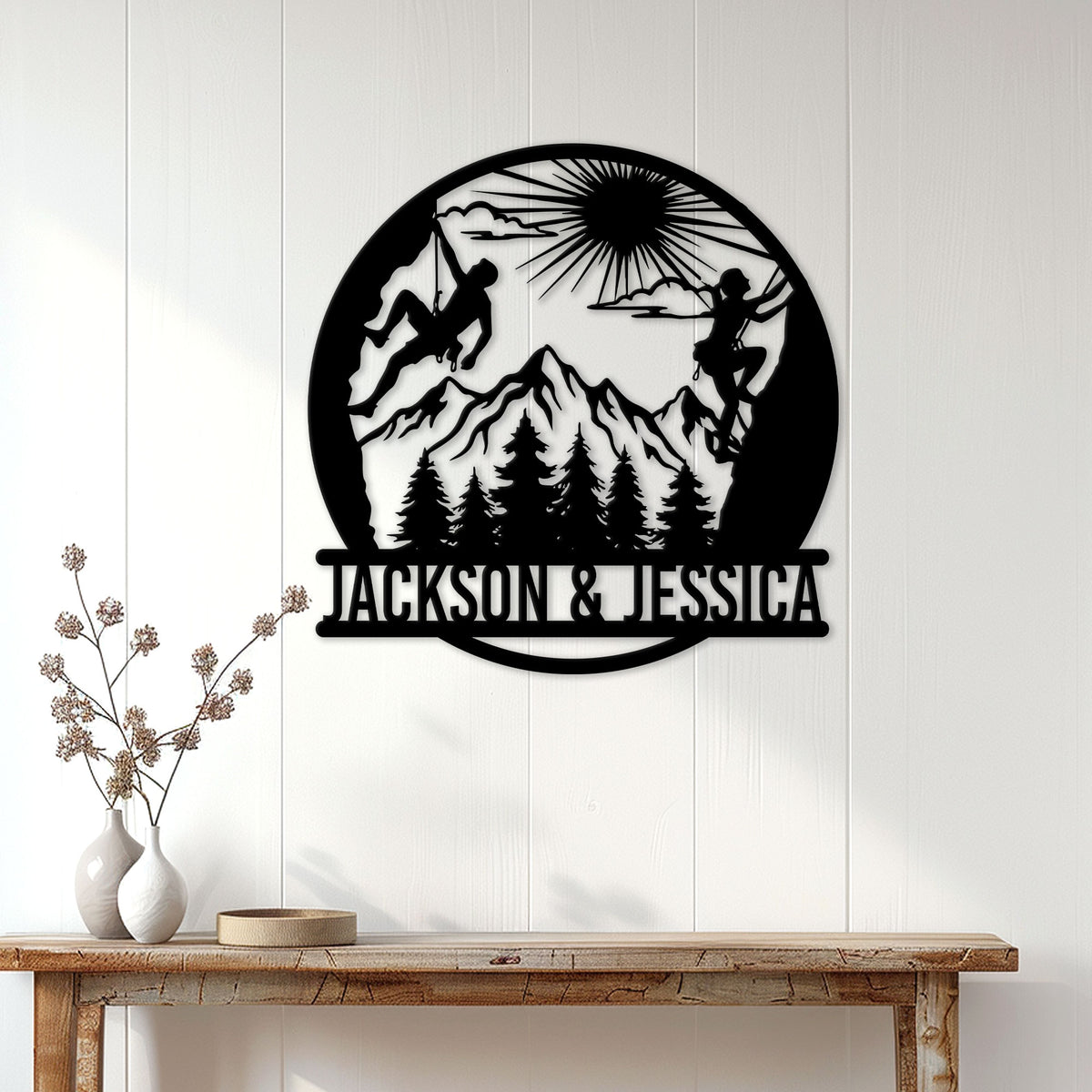 Rock climbing wall decor displayed on a white wood wall above a rustic console table