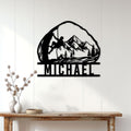 Rock climbing wall sign displayed on a light wood-paneled wall above a console table