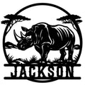 Custom rhino metal sign featuring a bold rhinoceros beneath acacia trees in a circular wildlife scene