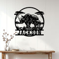 Rhino mother and calf metal wall sign displayed on a light paneled entryway wall