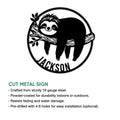 Cut-metal sign feature graphic showing a smiling sloth hanging from a branch in a round design