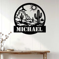 Cactus desert metal wall sign displayed on white paneling above a rustic console table