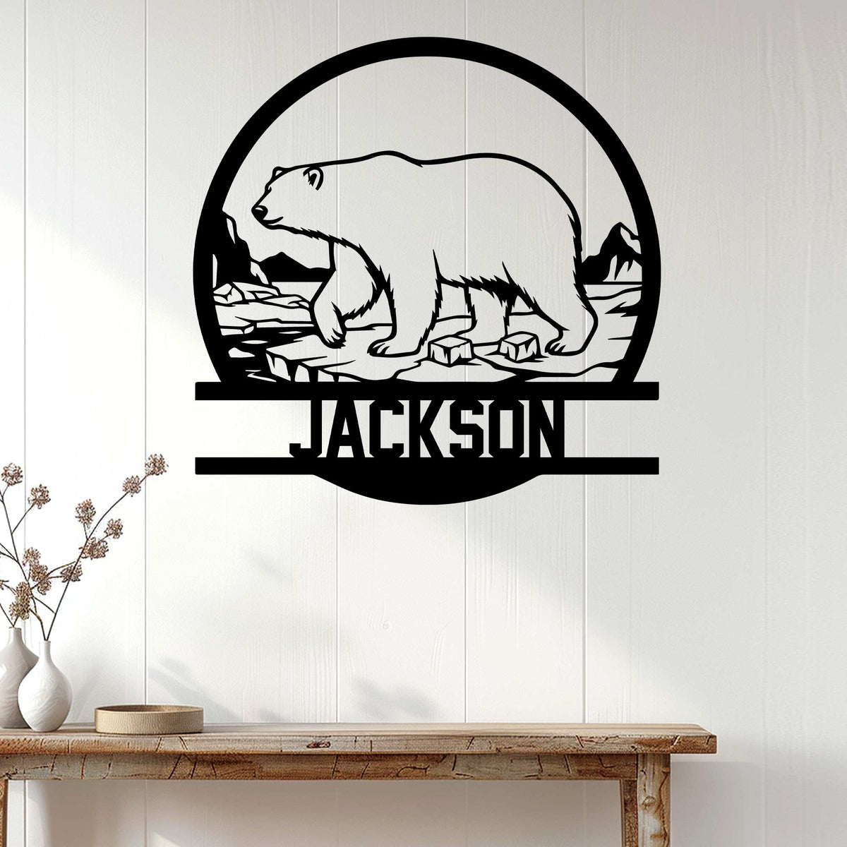 Polar bear wall sign displayed on a light wood wall above a console table in a modern home