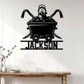 Coal mining wall decor displayed on a light wood-paneled wall above a console table