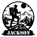 Custom hiking metal sign featuring a backpacker with trekking poles in a mountain and pine forest silhouette