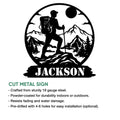 Cut metal hiking sign feature graphic showing a backpacker, mountain landscape, and circular outdoor design