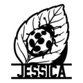 Custom ladybug metal sign featuring a spotted beetle resting on a detailed leaf silhouette