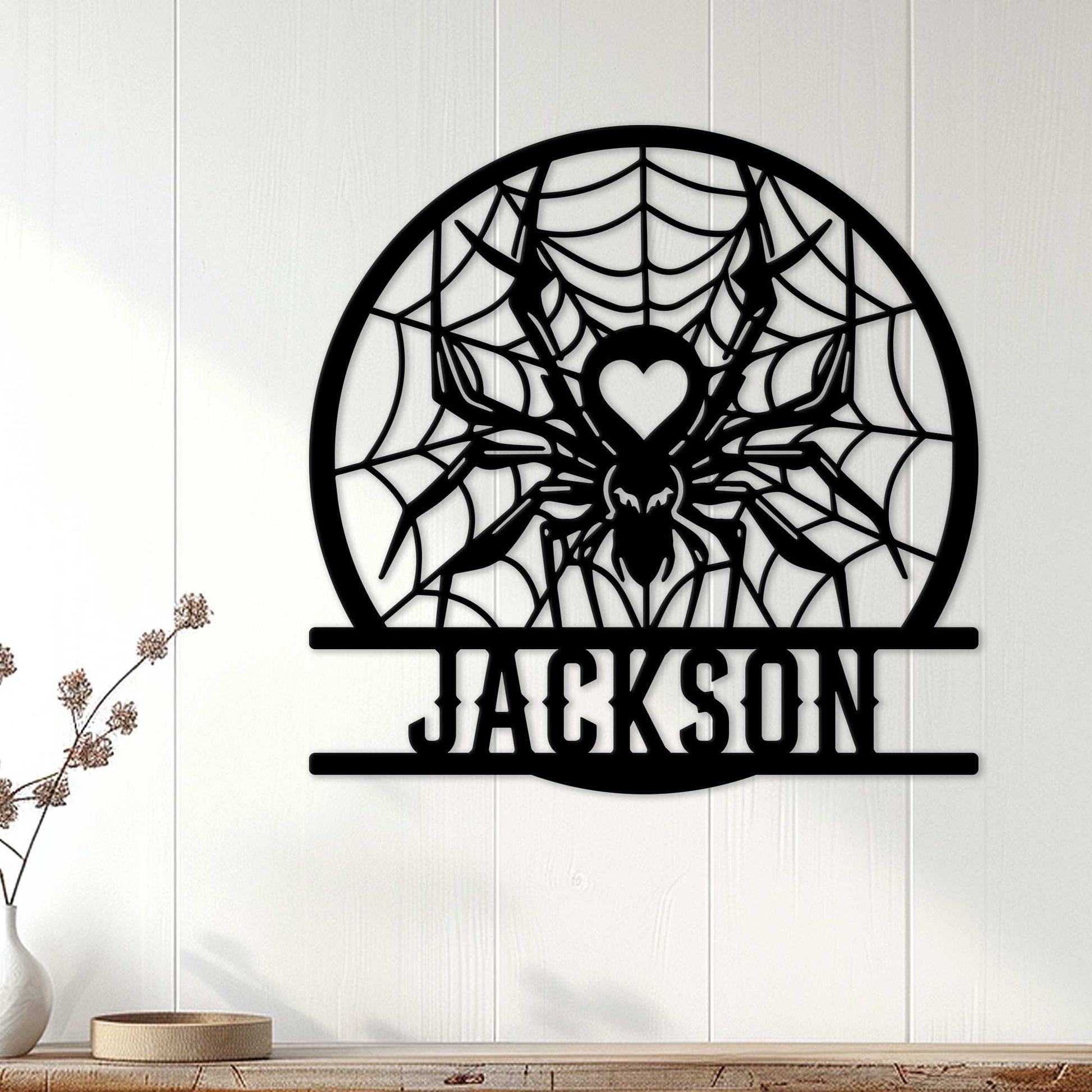 Spider web metal wall sign displayed on a light wood-paneled wall in a modern home setting