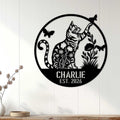 Tabby cat metal sign displayed on a white paneled wall in a cozy home decor setting