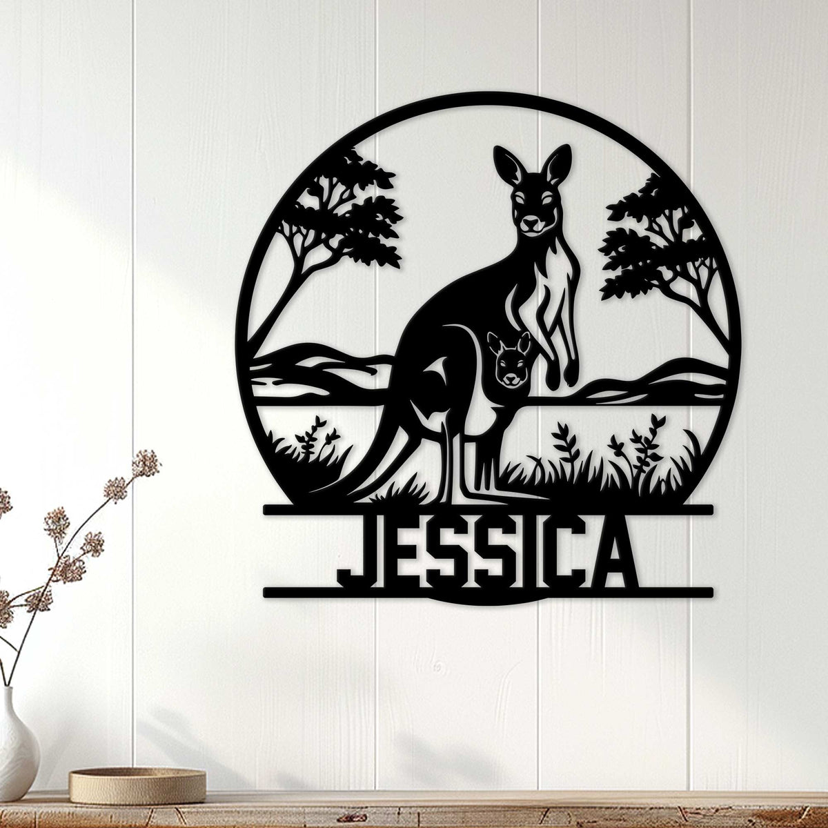 Kangaroo family wall decor displayed on white paneled interior wall above a console